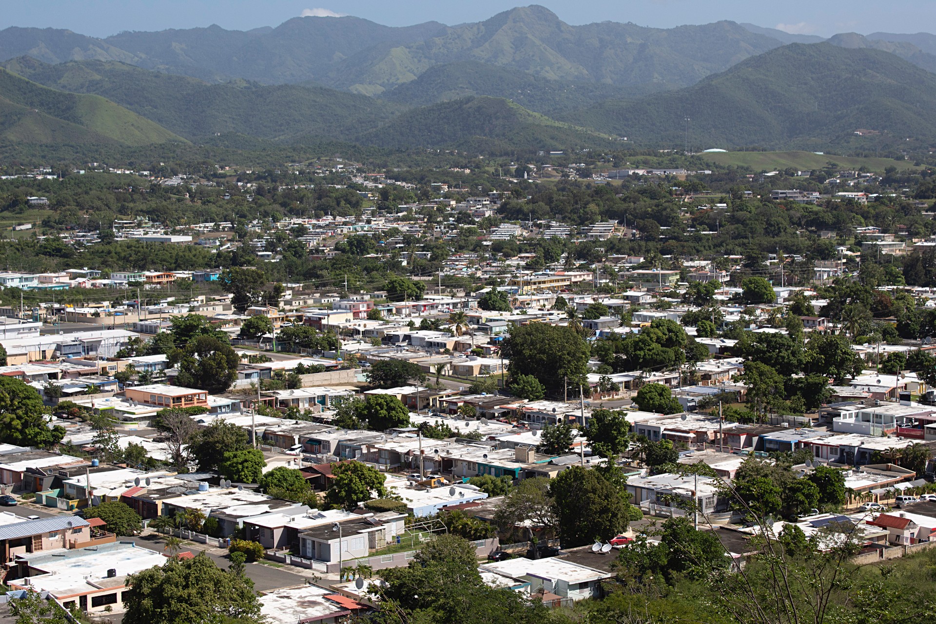 High Angle View Of Townscape And Mountains